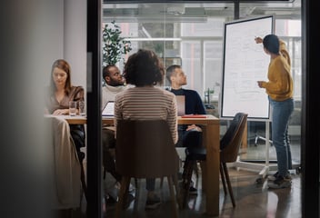 Project manager makes a presentation for a creative team in the agency's conference room.