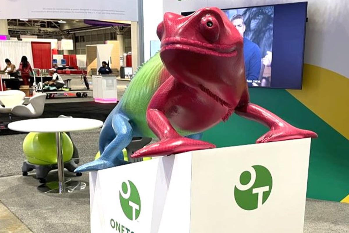Colorful chameleon mascot at trade show booth